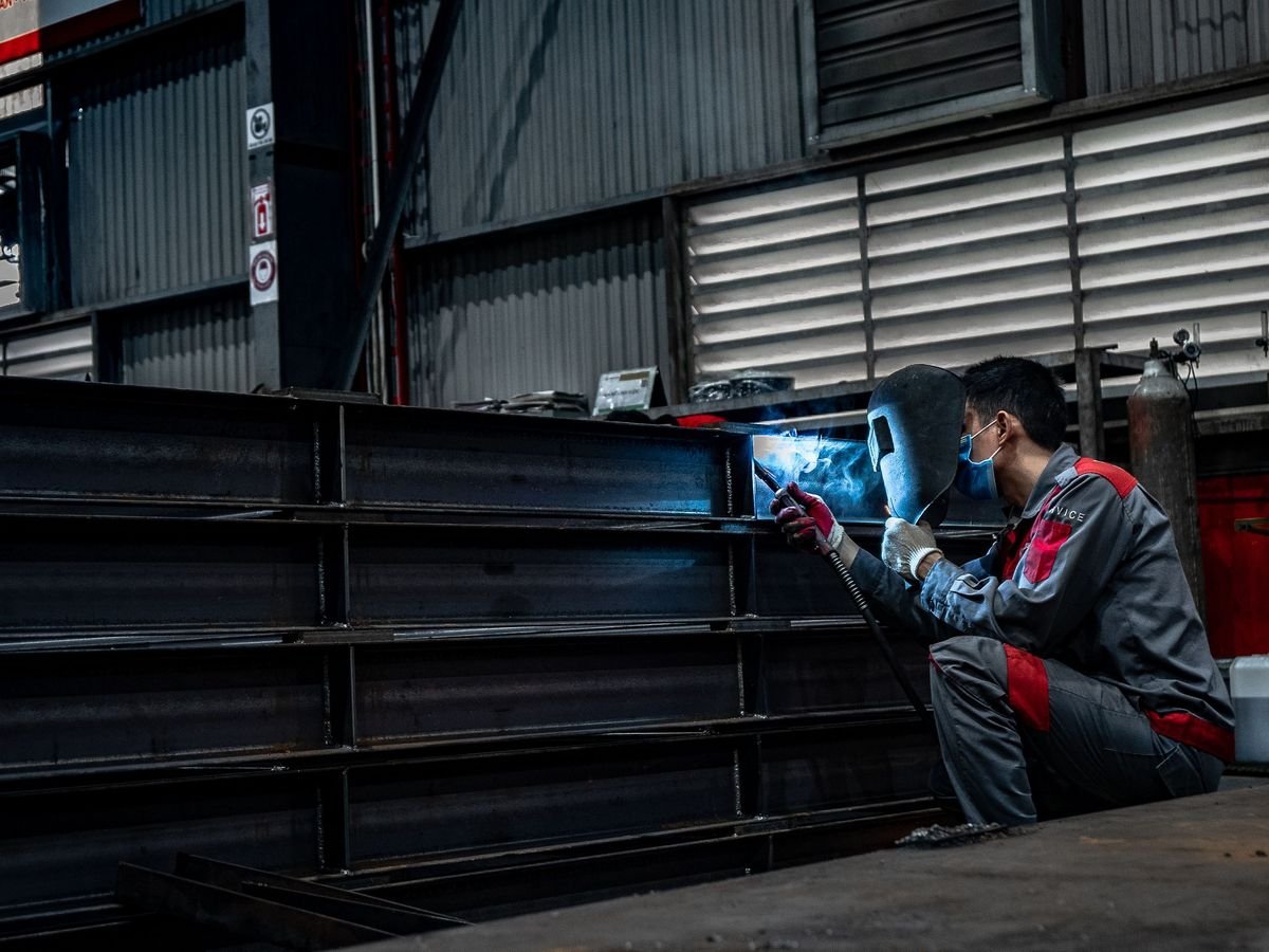 Welding a fabricated steel beam assembly